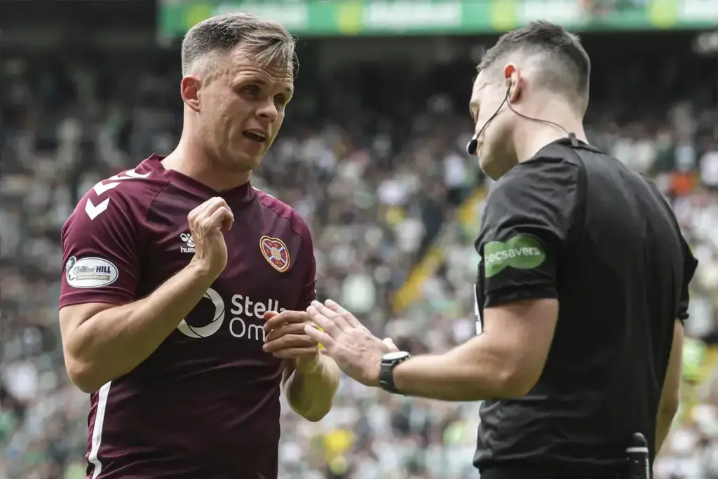 Lawrence Shankland of Heart of Midlothian protests to referee Don Robertson after he awards a penalty kick to Celtic during the William Hill Premiership match at Celtic Park, Glasgow 16/05/2026