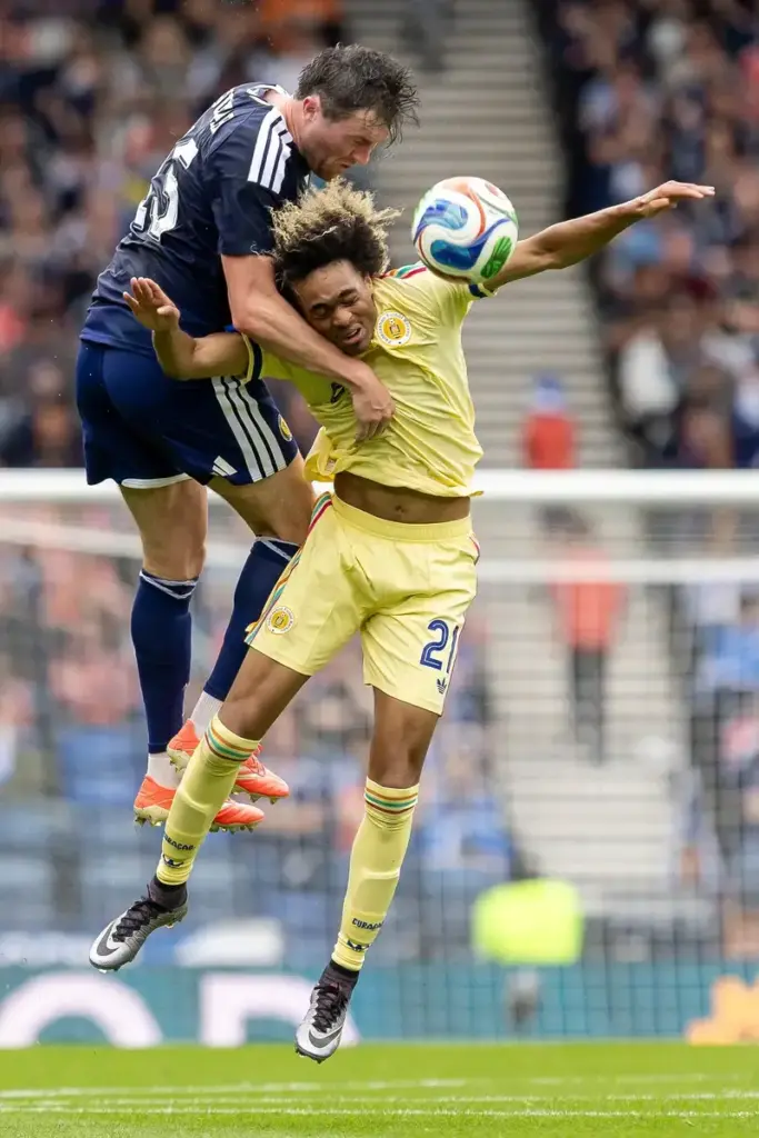 John Souttar of Scotland National Team challenges Tahith Chong of Curacao for a header during the International Challenge Match - Scotland vs Curacao, Barclays Hampden, Glasgow. 30 May 2026