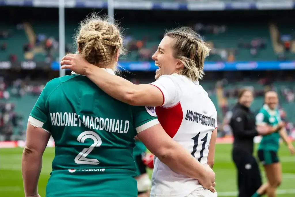 Claudia Moloney-MacDonald of England has a laugh with wife Cliodhna Moloney-MacDonald of Ireland after the Women's Six Nations Rugby match between England Women and Ireland Women at Allianz Stadium, Twickenham, UK on 11 April 2026.