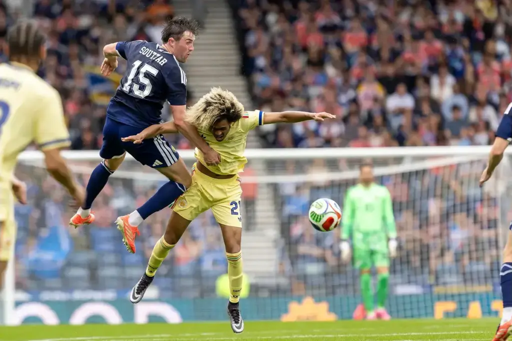 John Souttar of Scotland National Team challenges Tahith Chong of Curacao for a header during the International Challenge Match - Scotland vs Curacao, Barclays Hampden, Glasgow. 30 May 2026